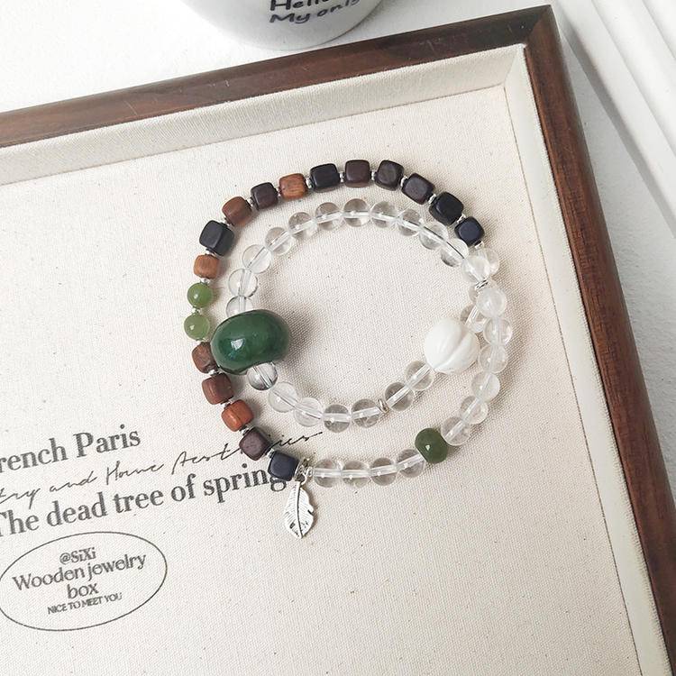 Healing double wrap bracelet featuring clear quartz, jade, and agarwood for emotional well-being and energy balance.

