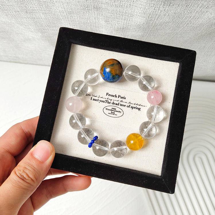 Clear quartz and multi-gemstone bracelet promoting healing, balance, and positive energy.

