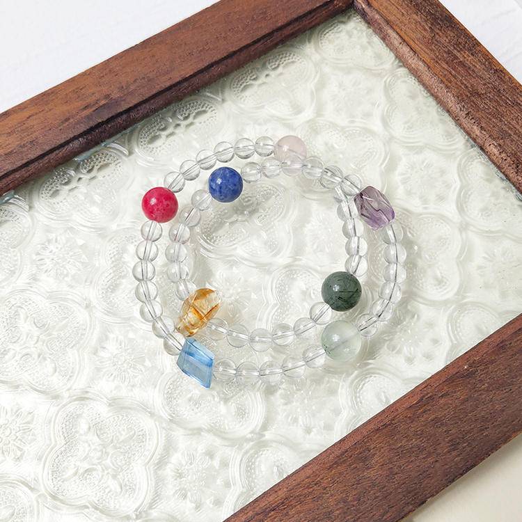 Double-wrap bracelet with clear quartz and multi-gemstones, designed to enhance healing, balance, and positive energy.
