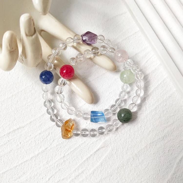Healing bracelet featuring clear quartz and multiple gemstones for energy, balance, and emotional well-being.
