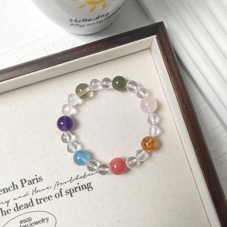 Clear quartz multi-gemstone bracelet with rose quartz, yellow tiger quartz, pink salt stone, aquamarine, amethyst, citrine, and Hetian jade, promoting healing, balance, and positive energy.

