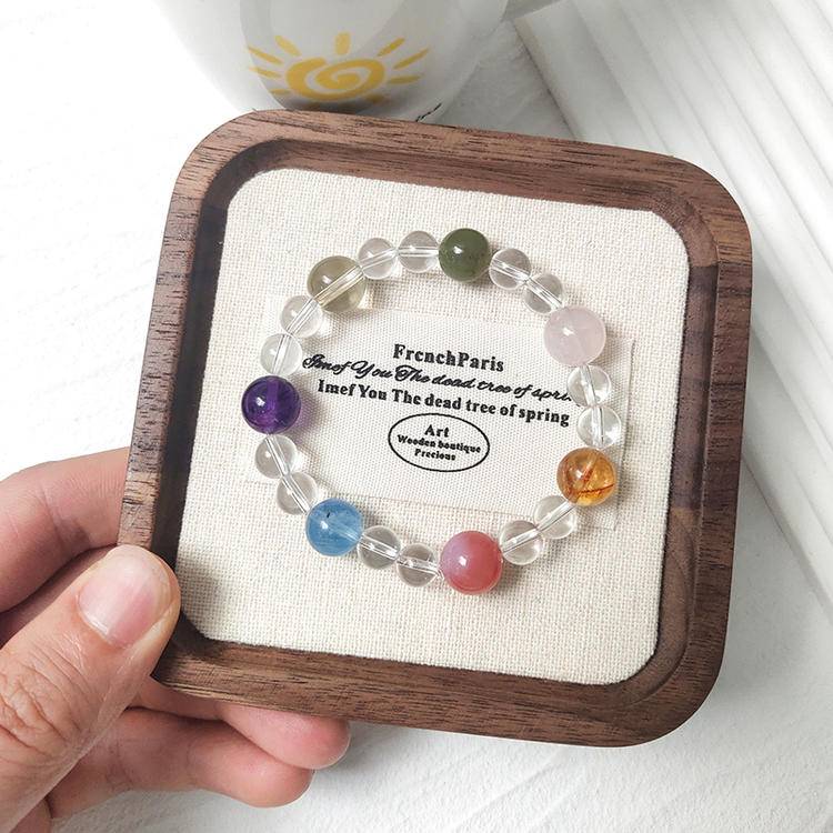 Multi-gemstone bracelet with clear quartz, rose quartz, yellow tiger quartz, pink salt stone, aquamarine, amethyst, citrine, and Hetian jade, designed to enhance healing, positive energy, and balance.
