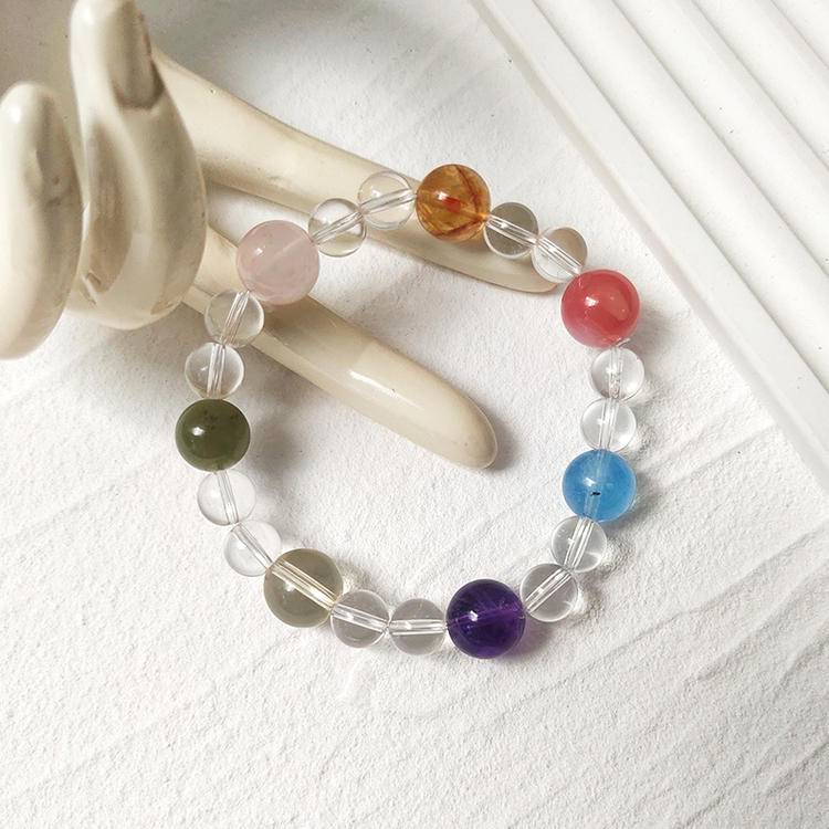 Healing multi-gemstone bracelet featuring clear quartz, rose quartz, yellow tiger quartz, pink salt stone, aquamarine, amethyst, citrine, and Hetian jade for emotional well-being and energy balance.

