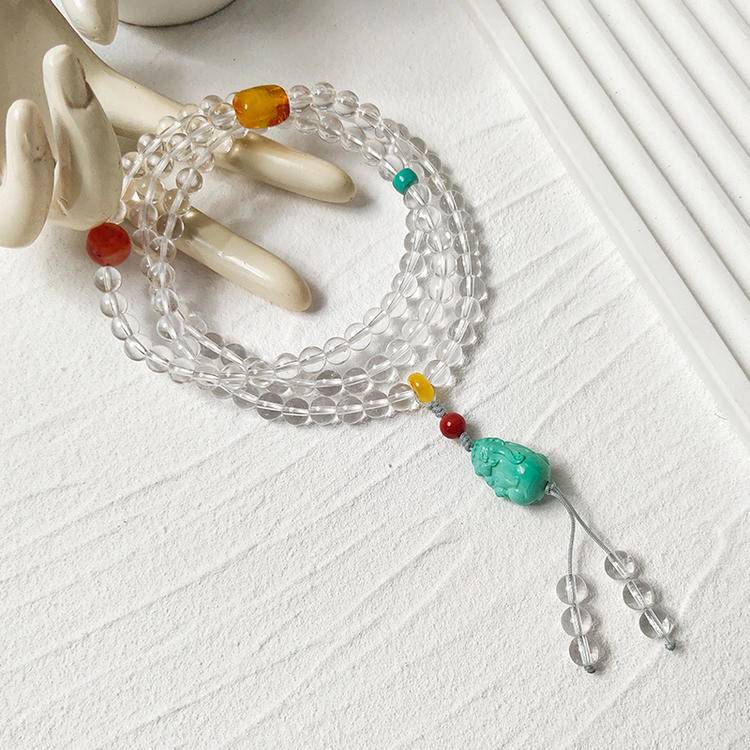Meditation beads featuring clear quartz and turquoise pixiu for emotional balance, focus, and positive energy.
