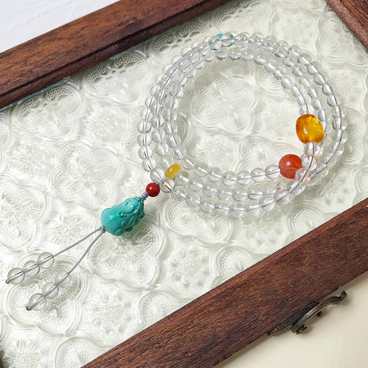 108-bead prayer beads with clear quartz and turquoise pixiu, designed to enhance focus, healing, and positive energy.
