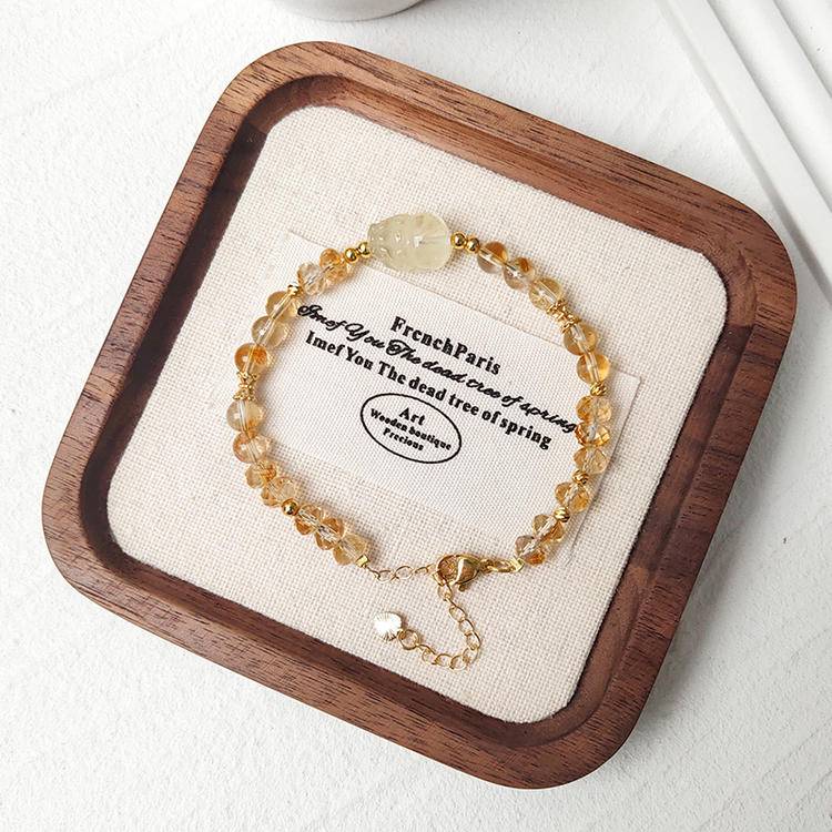 Healing multi-gem bracelet featuring faceted citrine and Pi Xiu for prosperity, balance, and focus.