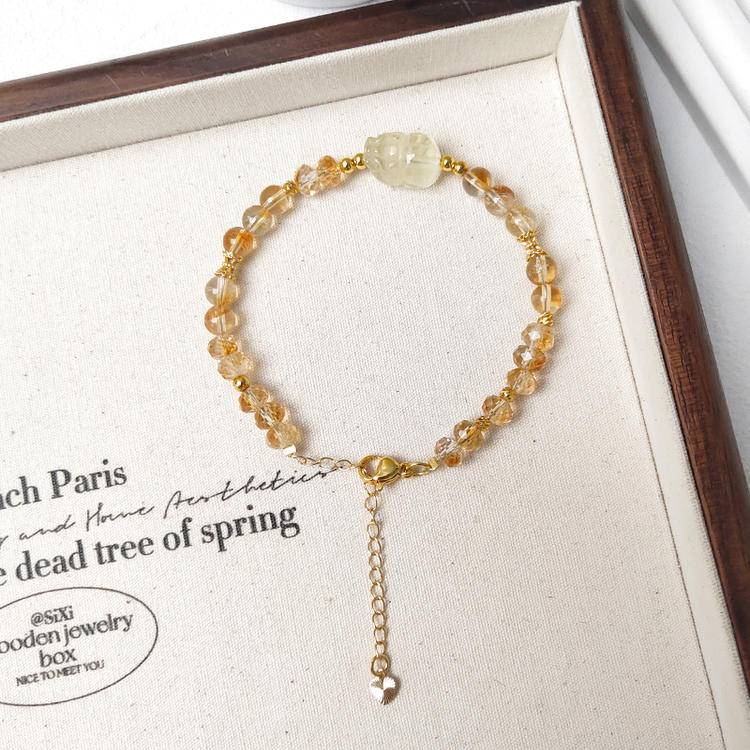 Faceted citrine and Pi Xiu bracelet promoting wealth, protection, and positive energy.