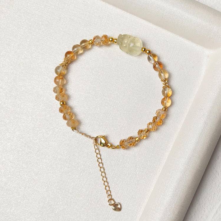 Multi-gem bracelet with faceted citrine and Pi Xiu designed to enhance financial energy and positive intentions.