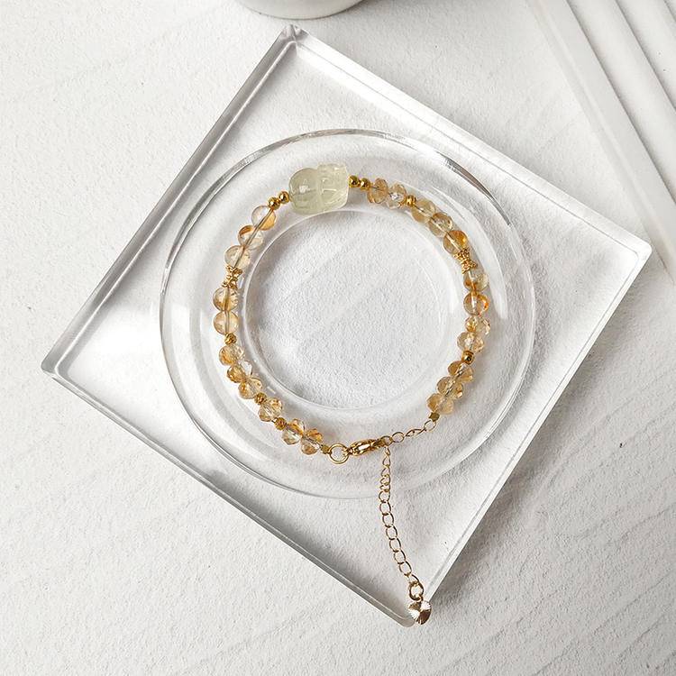 Faceted citrine and Pi Xiu bracelet supporting abundance, protection, and emotional well-being.