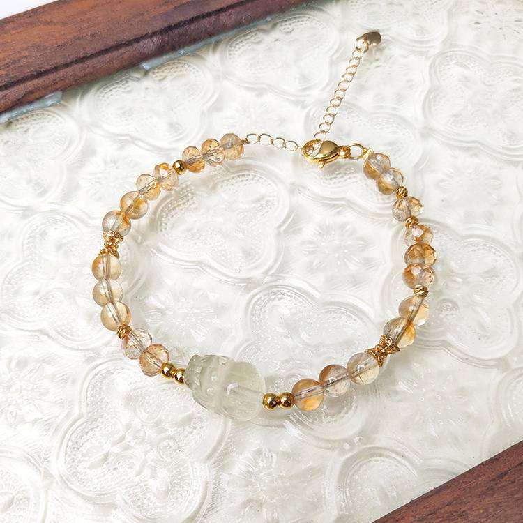 Faceted citrine and Pi Xiu multi-gemstone bracelet designed to promote wealth, balance, and positive energy.