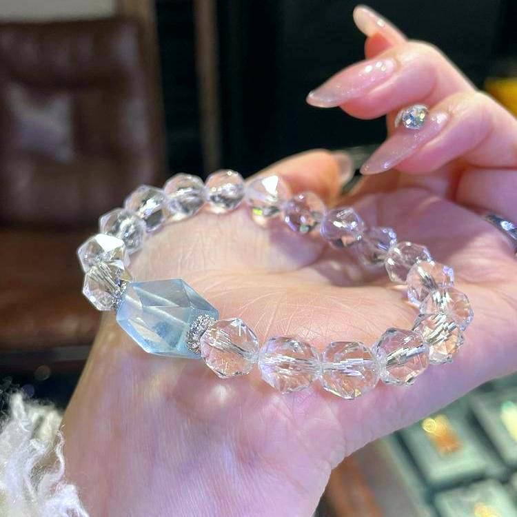 Faceted clear quartz and aquamarine multi-gemstone bracelet promoting healing, balance, and positive energy.
