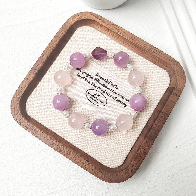 Kunzite, amethyst, and rose quartz bracelet supporting emotional balance, positive energy, and healing.
