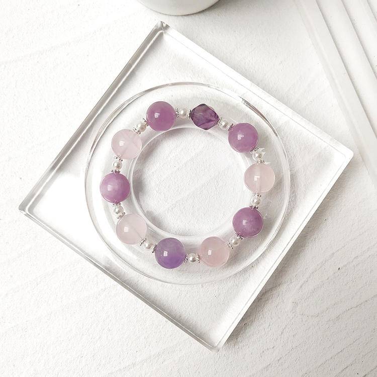 Kunzite, amethyst, and rose quartz multi-gemstone bracelet designed to promote healing, balance, and positive energy.
