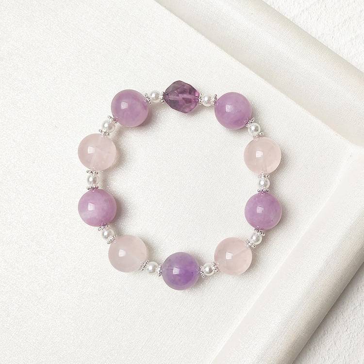 Kunzite, amethyst, and rose quartz multi-gemstone bracelet promoting healing, balance, and positive energy.
