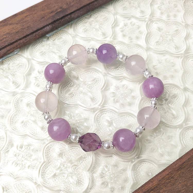 Multi-gem bracelet with kunzite, amethyst, and rose quartz, designed to enhance healing, balance, and positive energy.
