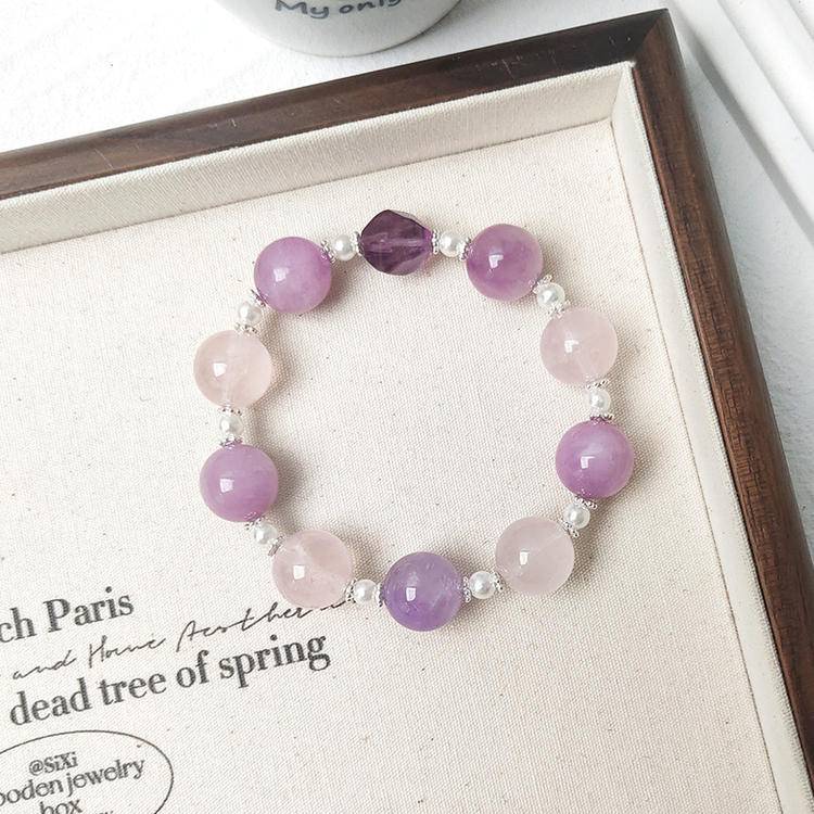 Healing multi-gemstone bracelet featuring kunzite, amethyst, and rose quartz for emotional well-being and energy balance.
