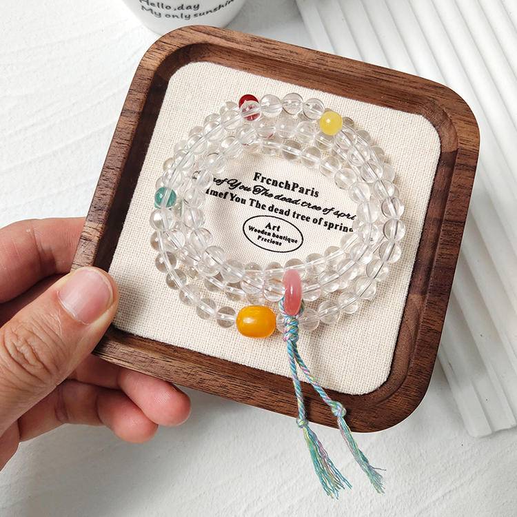 Nanhong agate, butterscotch amber, and clear quartz 108-bead mala supporting mindfulness, energy balance, and healing.
