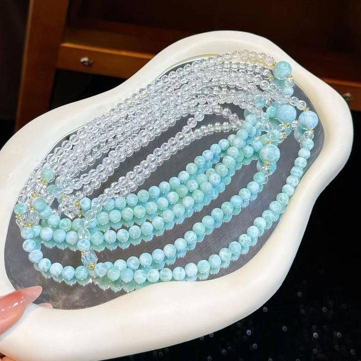 Larimar and clear quartz bracelet designed to encourage calm energy and emotional harmony.