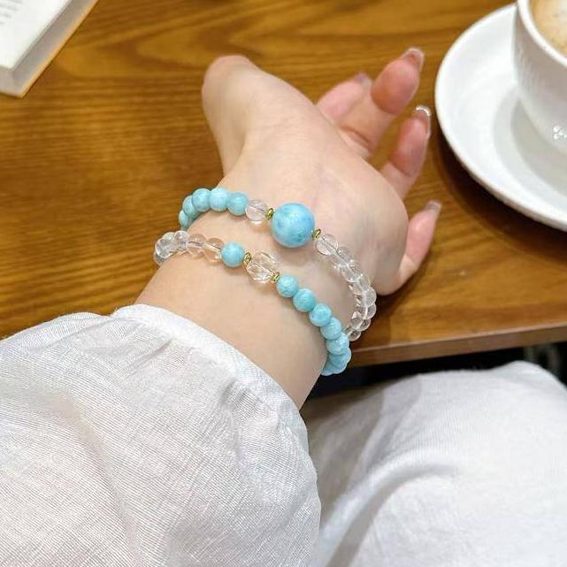 Double-strand bracelet with larimar and clear quartz for soothing energy and mental clarity.