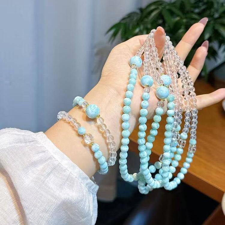 Elegant double-strand bracelet featuring larimar and clear quartz for relaxation and inner peace.