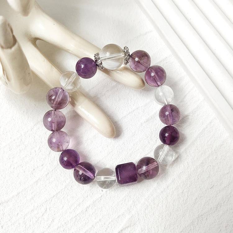 Purple apatite, amethyst, and clear quartz bracelet supporting emotional balance, positive energy, and healing.

