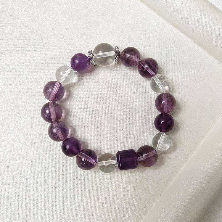 Multi-gem bracelet with purple apatite, amethyst, and clear quartz, designed to enhance healing, balance, and positive energy.
