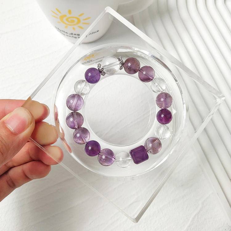 Purple apatite, amethyst, and clear quartz multi-gemstone bracelet designed to promote healing, balance, and positive energy.

