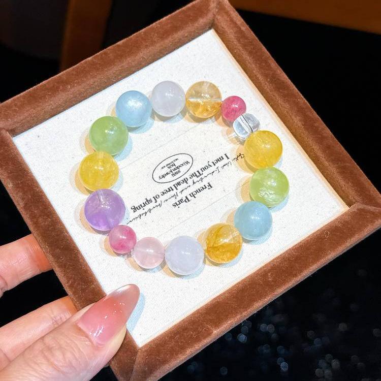 Multi-gem bracelet with rhodochrosite and aquamarine to encourage love, peace, and positivity.