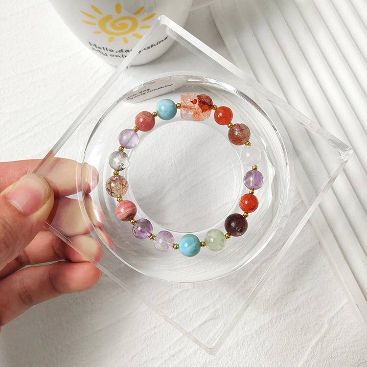 Red jade pixiu multi-gemstone bracelet with black gold crystal, amethyst, rhodonite, agate, clear phantom quartz, gold sunstone, lepidolite, and prehnite, designed for healing, protection, and emotional balance.
