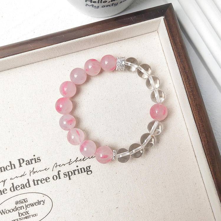 Rhodonite and clear quartz multi-gemstone bracelet promoting healing, balance, and positive energy.
