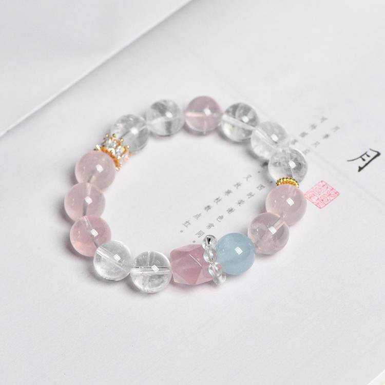 Rose quartz, aquamarine, and clear quartz bracelet supporting emotional balance, positive energy, and healing.