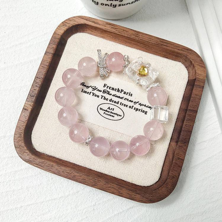 Rose quartz bear bracelet promoting healing, balance, and positive energy.