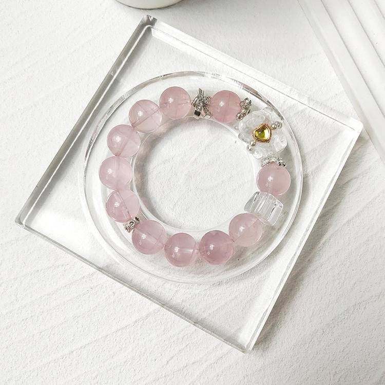 Rose quartz bear multi-gemstone bracelet designed to promote healing, balance, and positive energy.