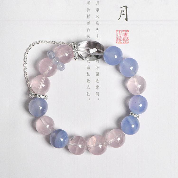 Multi-gem bracelet with rose quartz and blue vein agate, designed to enhance healing, balance, and positive energy.