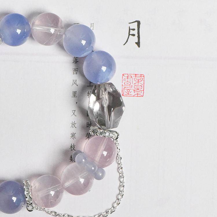 Healing multi-gem bracelet featuring rose quartz and blue vein agate for emotional well-being and energy balance.