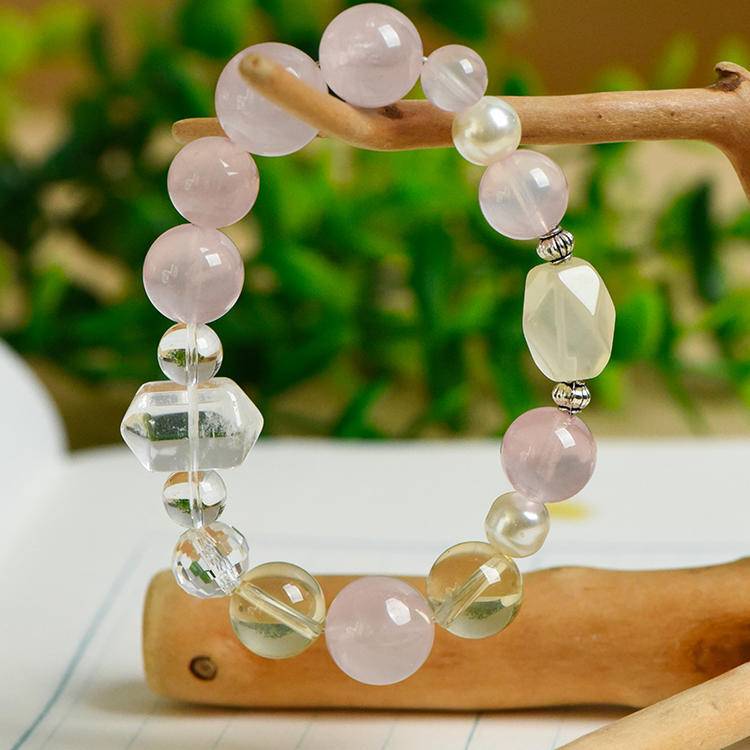 Rose quartz, citrine, and pearl multi-gem bracelet promoting healing, balance, and positive energy.