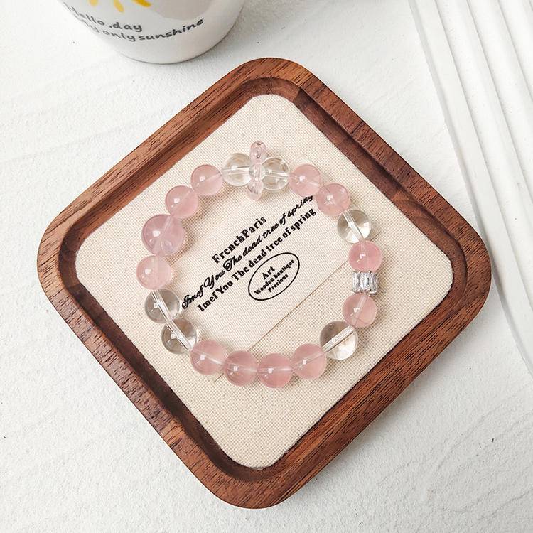 Rose quartz and clear quartz multi-gemstone bracelet promoting healing, balance, and positive energy.

