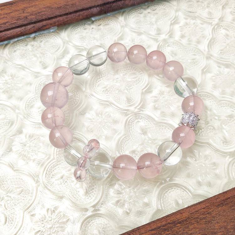Multi-gem bracelet with rose quartz and clear quartz, designed to enhance healing, balance, and positive energy.
