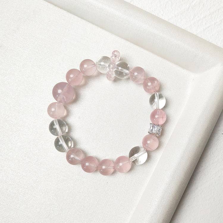 Rose quartz and clear quartz bracelet supporting emotional balance, positive energy, and healing.
