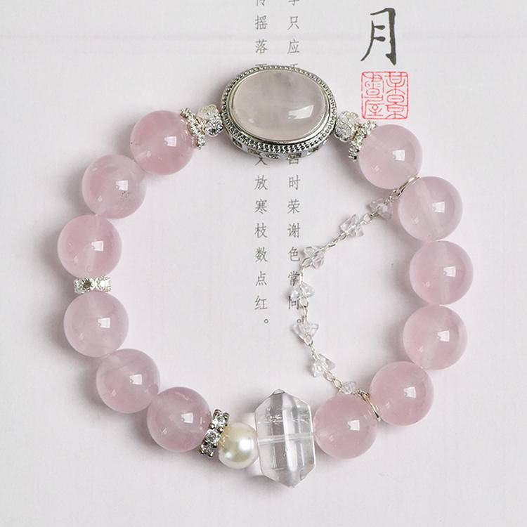 Healing multi-gem bracelet featuring rose quartz, clear quartz, and pearl for emotional well-being and energy balance.