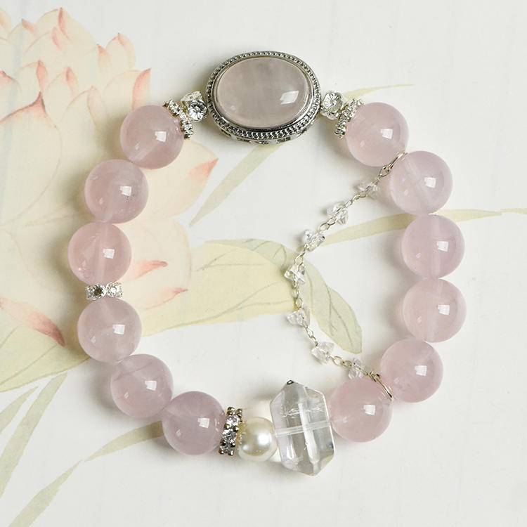 Rose quartz, clear quartz, and pearl bracelet supporting emotional balance, positive energy, and healing.