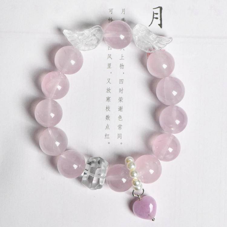 Multi-gem bracelet with rose quartz and clear quartz designed to enhance healing, protection, and positive energy.