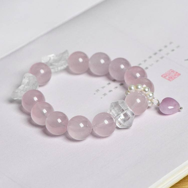 Rose quartz and clear quartz bracelet supporting spiritual protection, emotional balance, and healing.