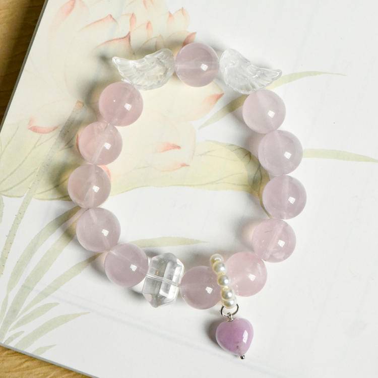 Healing multi-gem bracelet featuring rose quartz and clear quartz for protection, energy, and balance.