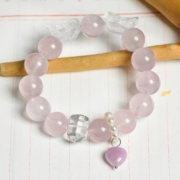 Rose quartz and clear quartz protection bracelet promoting healing, balance, and spiritual energy.