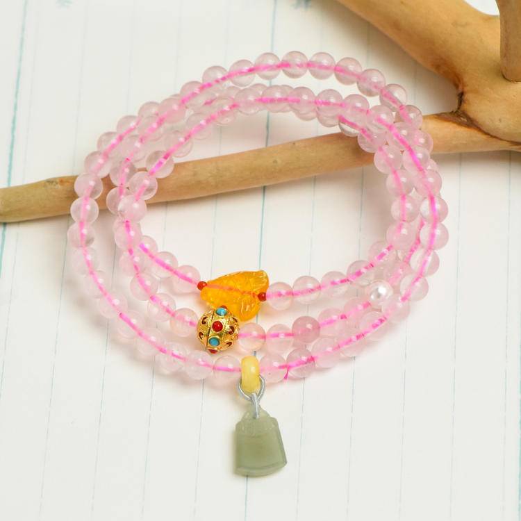 Rose quartz and Hetian jade triple-wrap bracelet supporting emotional balance, positive energy, and healing.