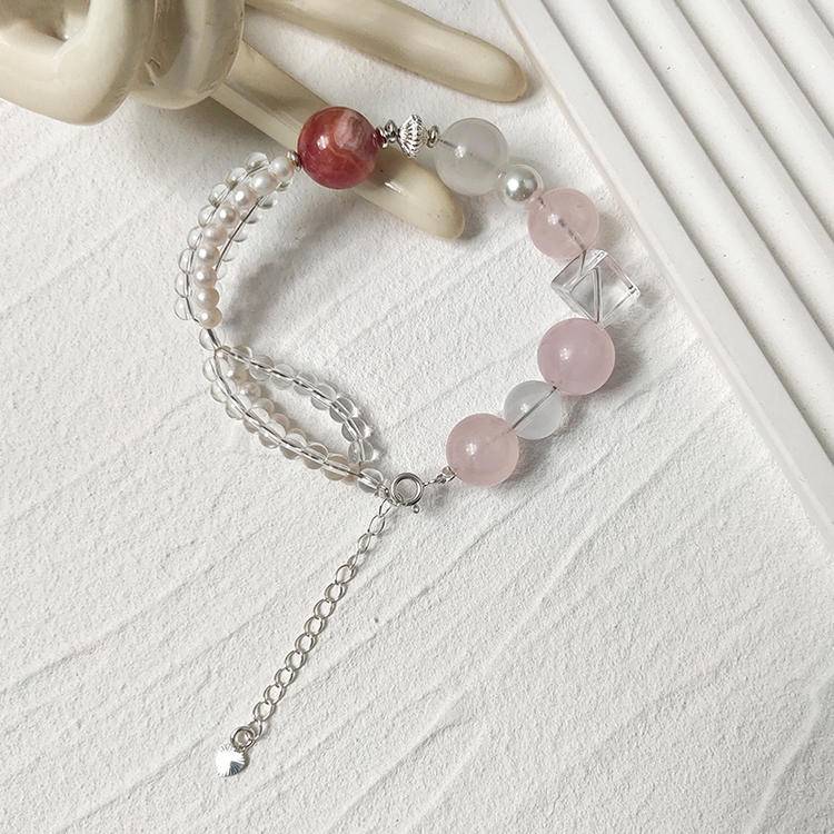 Rose quartz, pearl, and rhodochrosite multi-gem bracelet promoting healing, balance, and positive energy.