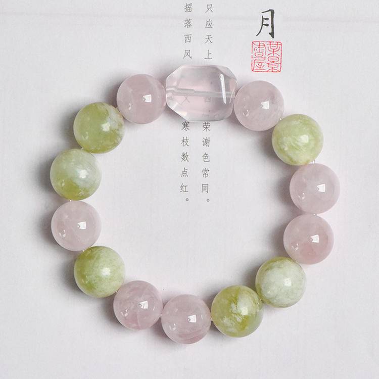Healing bracelet featuring rose quartz, Xiuyu jade, and clear quartz for energy, balance, and emotional well-being.