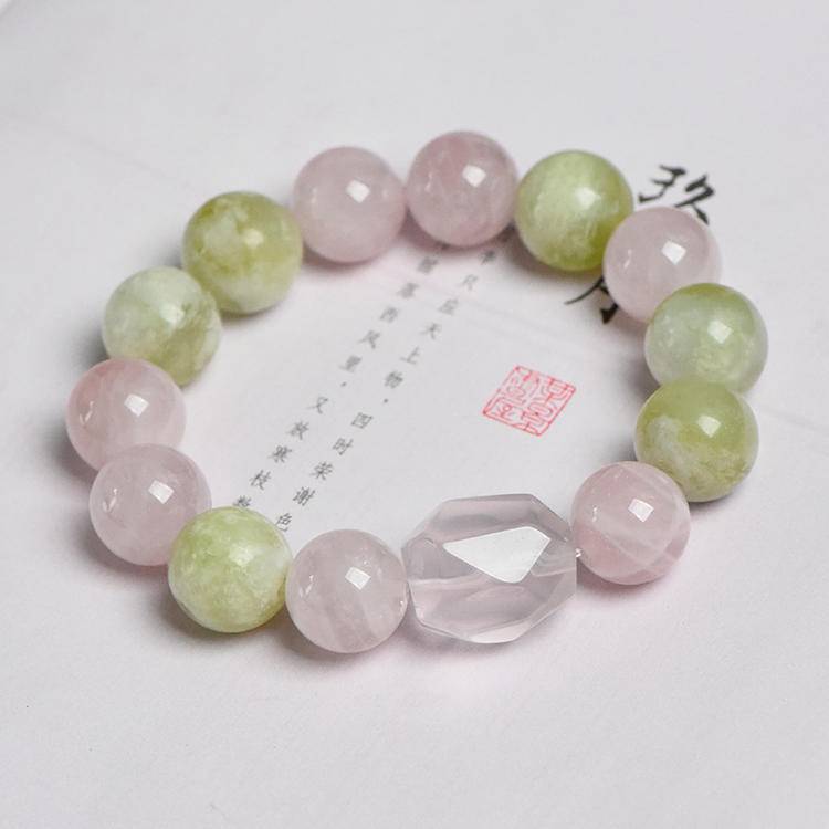 Rose quartz, Xiuyu jade, and clear quartz bracelet supporting emotional balance, positive energy, and healing.