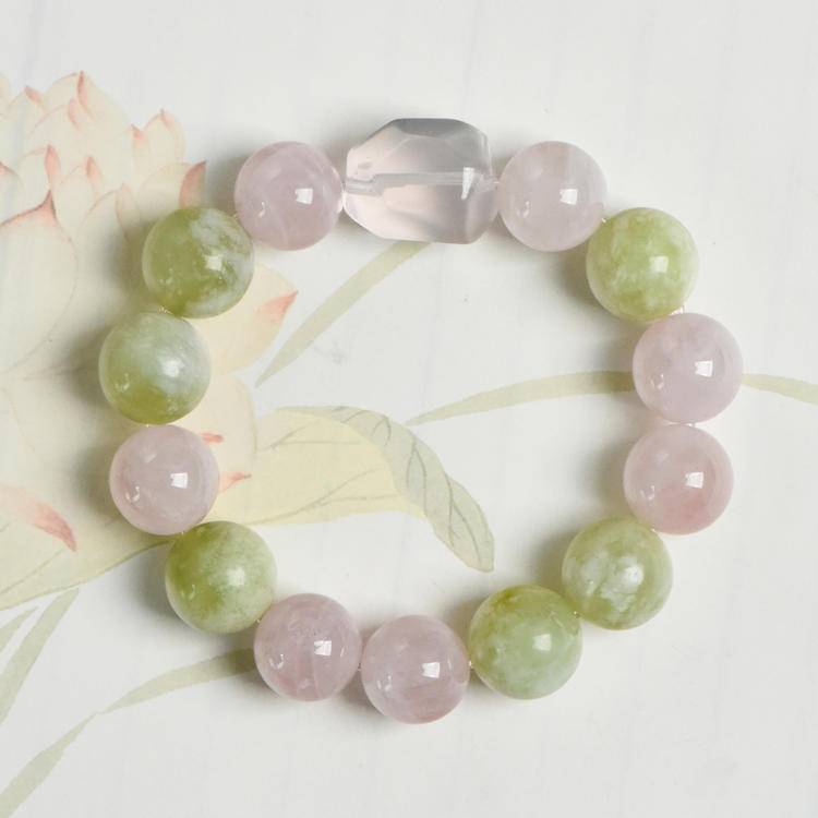 Healing multi-gem bracelet featuring rose quartz, Xiuyu jade, and clear quartz for emotional well-being and energy balance.